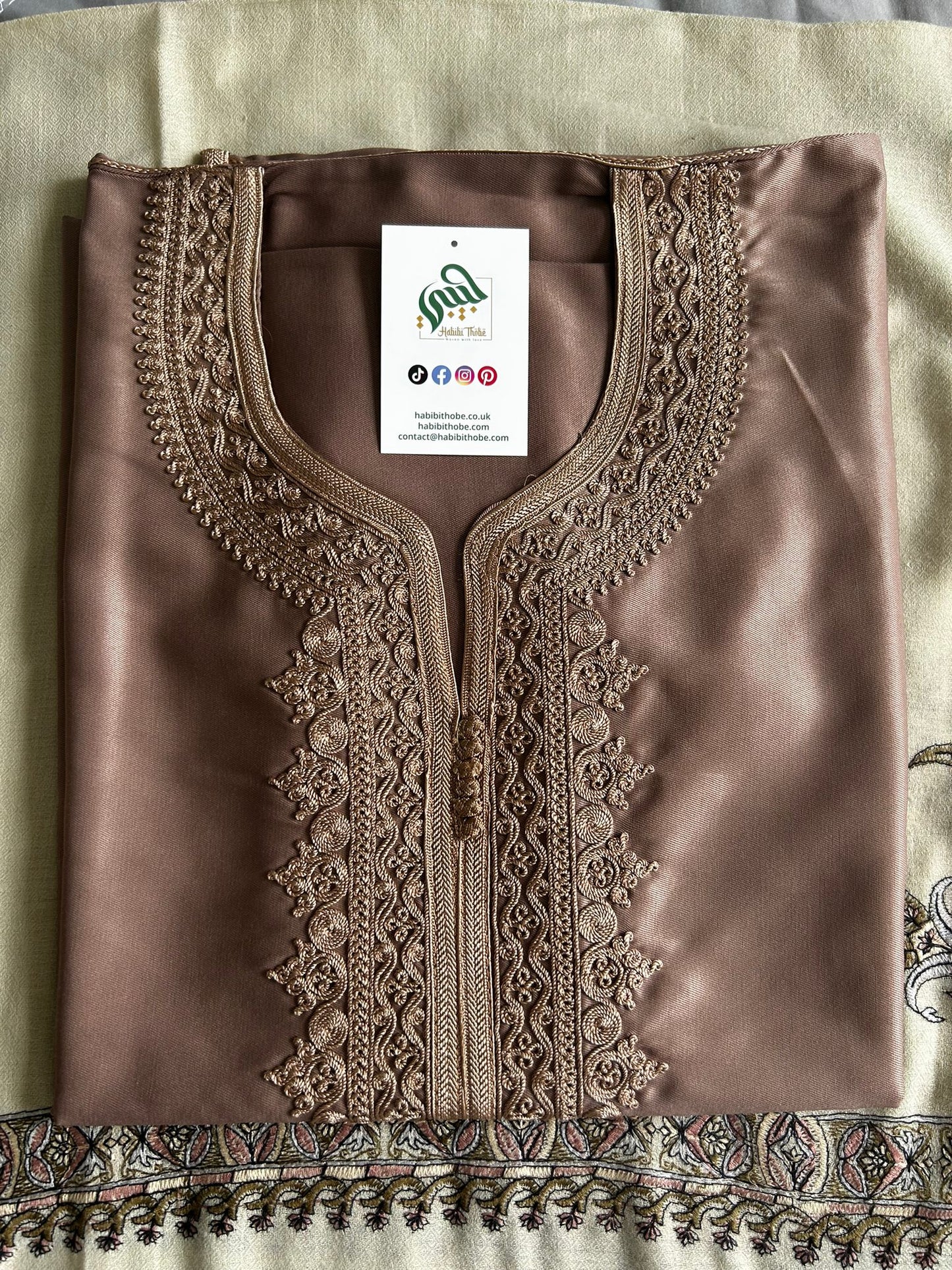 Warm beige Gandoura with golden embroidery, ideal for special occasions like Eid.
