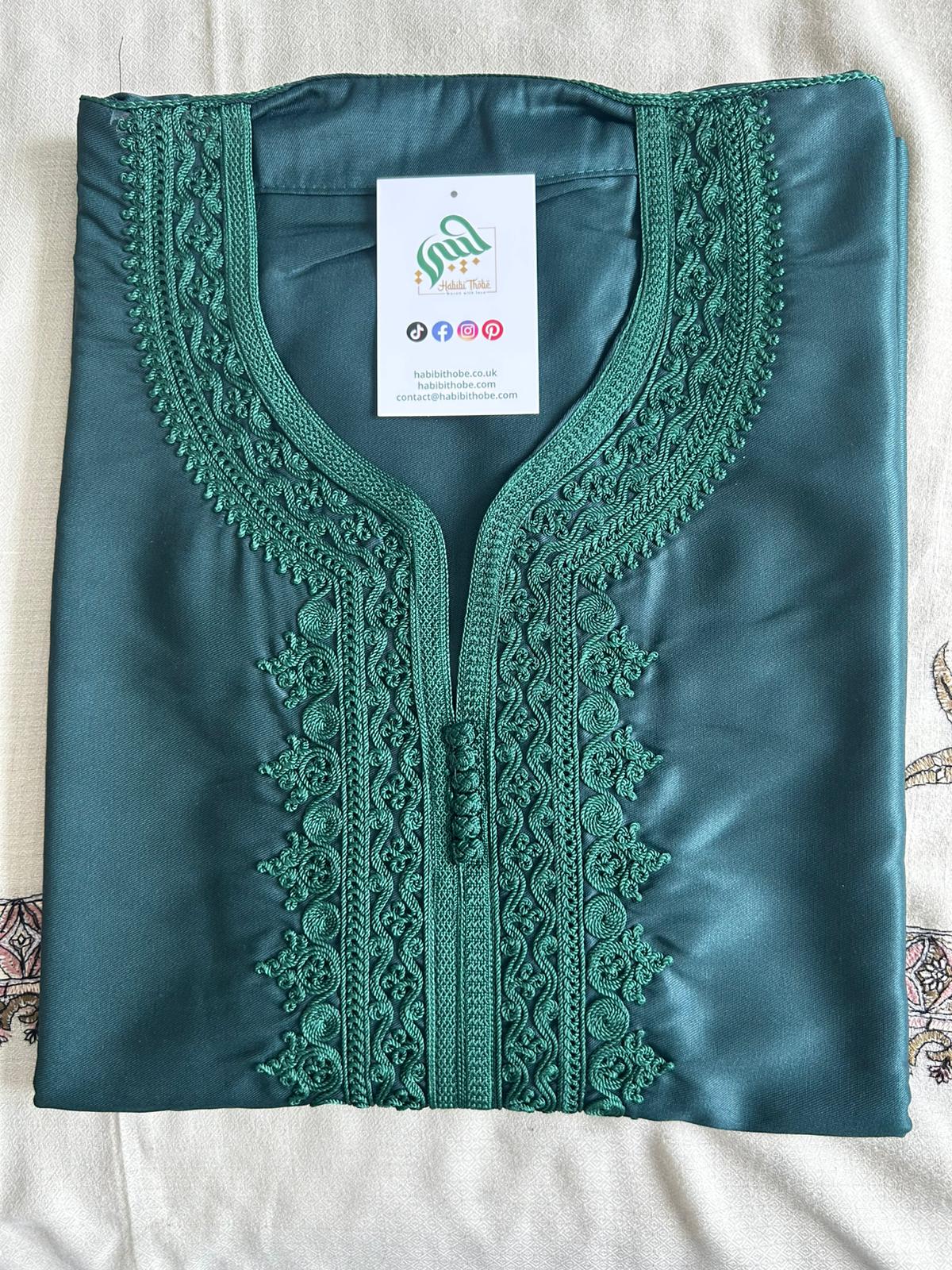 Rich emerald green Gandoura with intricate embroidery for festive occasions.