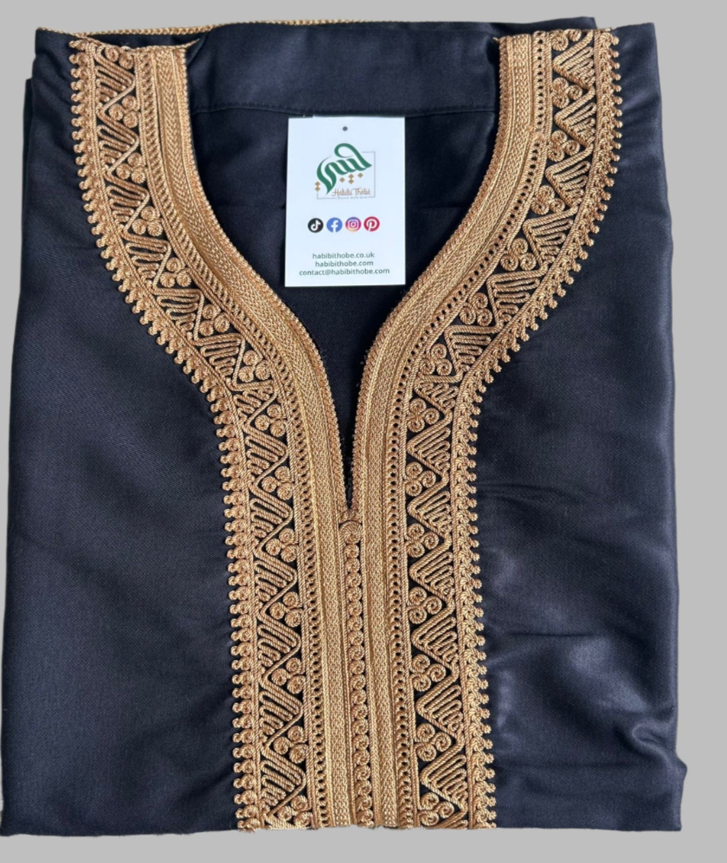 "Black Moroccan Gandoura featuring intricate royal gold embroidery, side pocket, and opposite side slit for easy access."