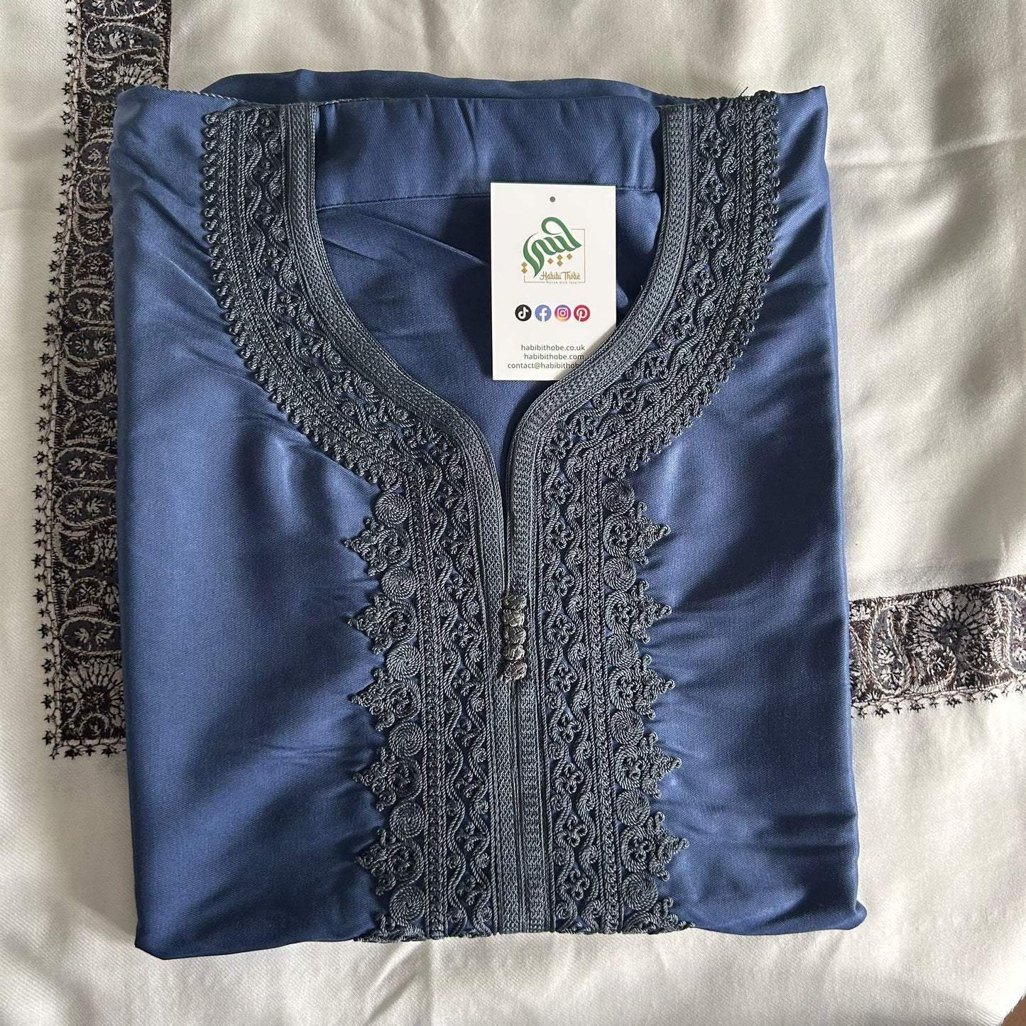 Elegant satin blue Gandoura with intricate embroidery, perfect for Eid, Jummah, or special occasions.