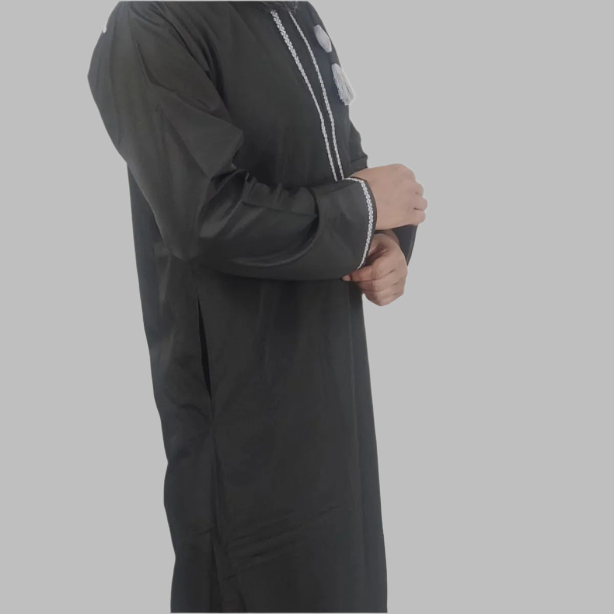 Model wearing Royal_Black_Omani_Thobe_left_side