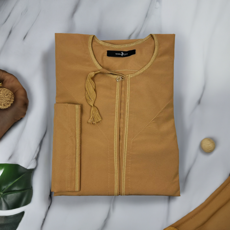Man wearing elegant Omani sand brown thobe showcasing traditional craftsmanship and plus-size comfort