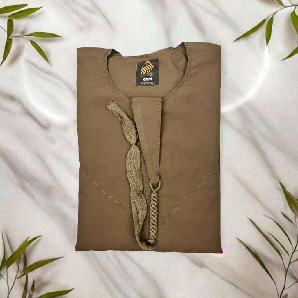 "Folded Basic Brown Emarati Thobe, neatly showcasing the premium quality material and the thobe's refined, compact design for easy storage."