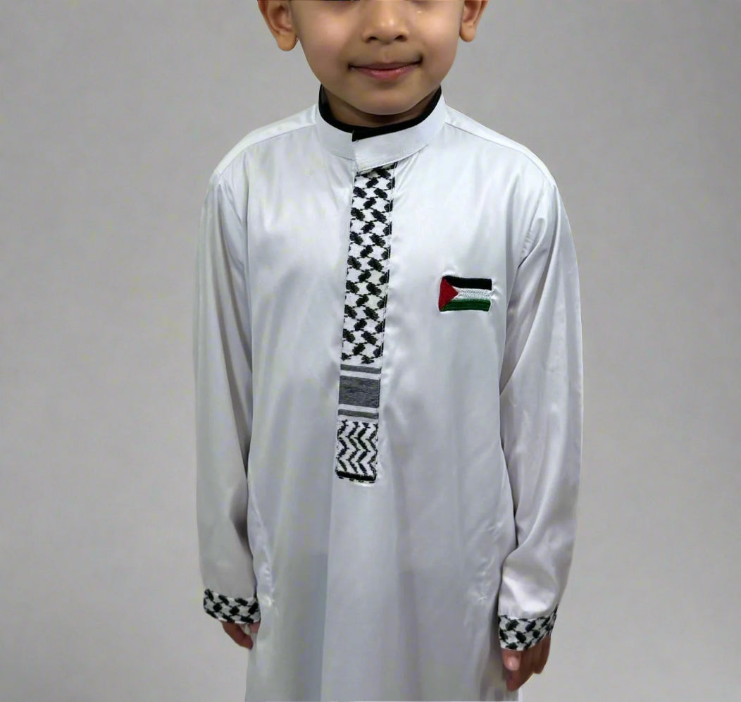 Close-up view of Boys Heritage Thobe featuring intricate design and flag, fine detailing, and premium fabric craftsmanship.