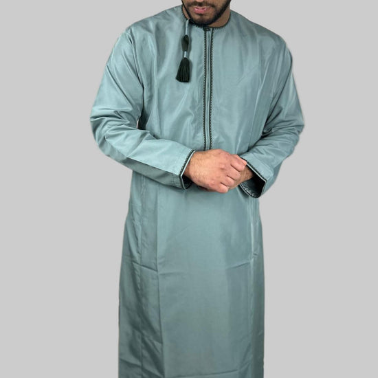 Omani Sultan teal green thobe with traditional neckline and green tassel detail, premium breathable fabric, cultural and modern design