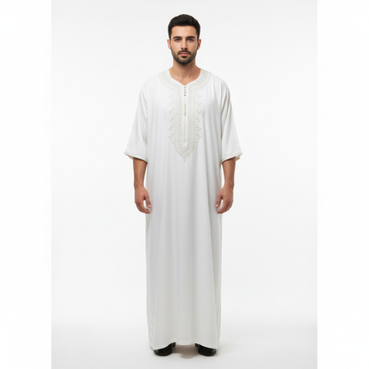 Man wearing a white gandoura on a white background