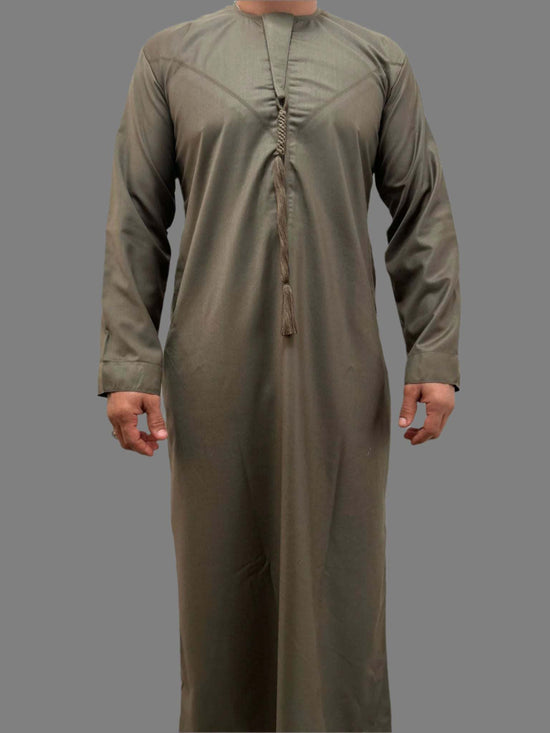 Man wearing Deluxe Emarati Mocha Thobe in rich mocha color showcasing premium fabric and elegant design