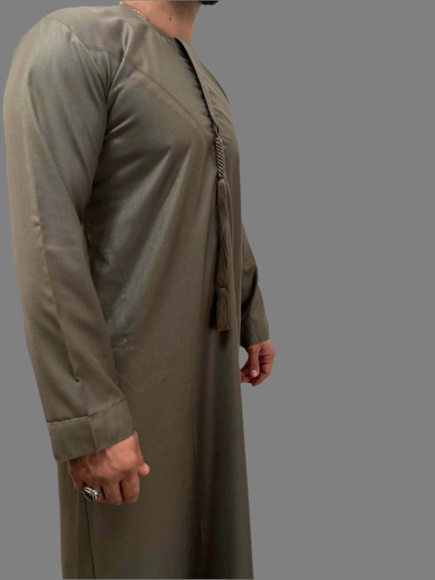 "Side view of the Deluxe Emarati Mocha Thobe, highlighting its tailored fit and sleek silhouette for a modern yet traditional style."