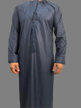 "Close-up of the luxurious fabric of the Deluxe Emarati Navy Blue Thobe