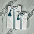 Boys wearing premium Omani white thobe with emerald green tassel for special occasions