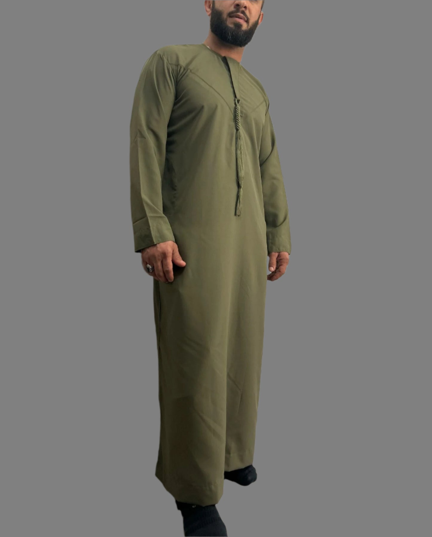 "Model wearing the Premium Khaki Emarati Thobe, demonstrating the comfortable fit and elegant design, with the detachable tassel."